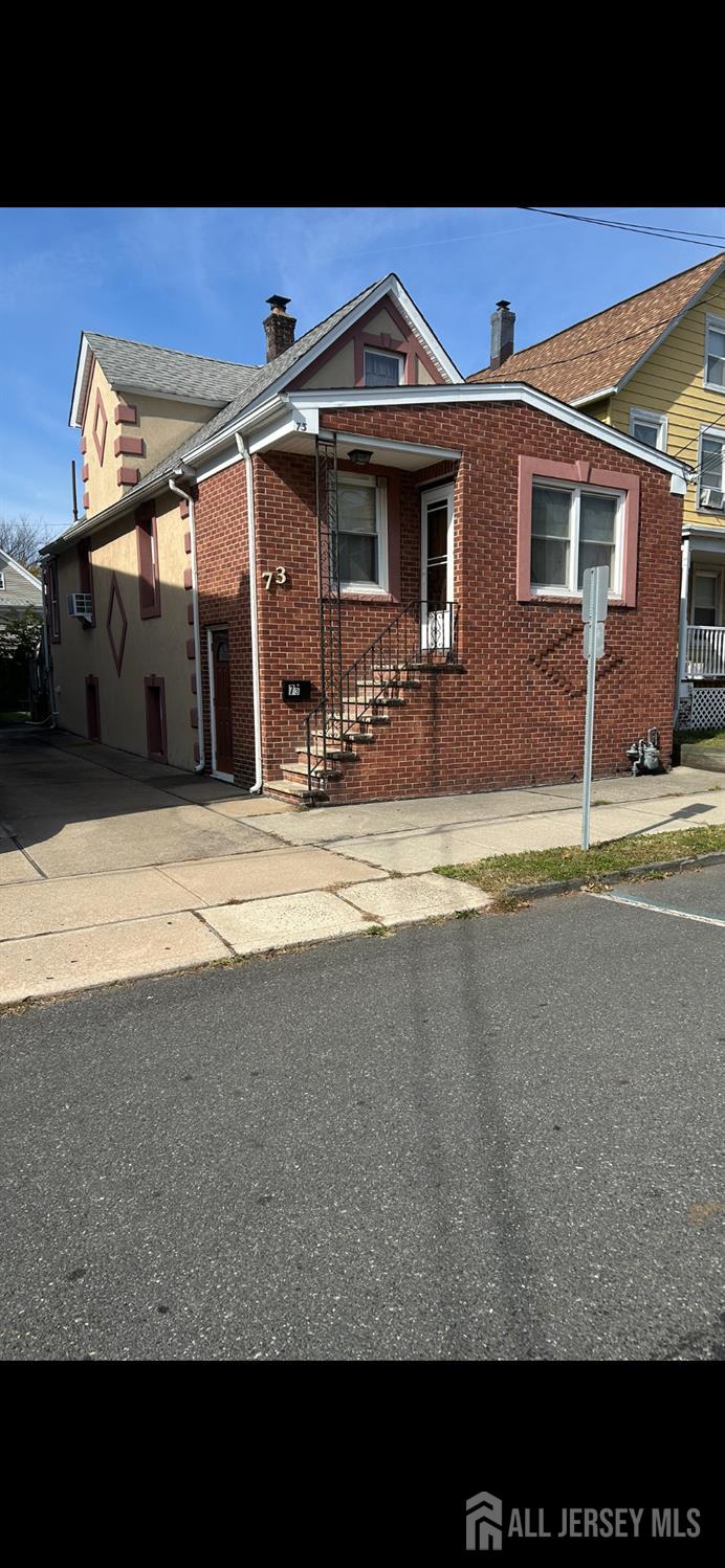 73 Edgar Street Carteret, NJ 07008 - Photo 5 of 5 a view of the front of house with swimming pool