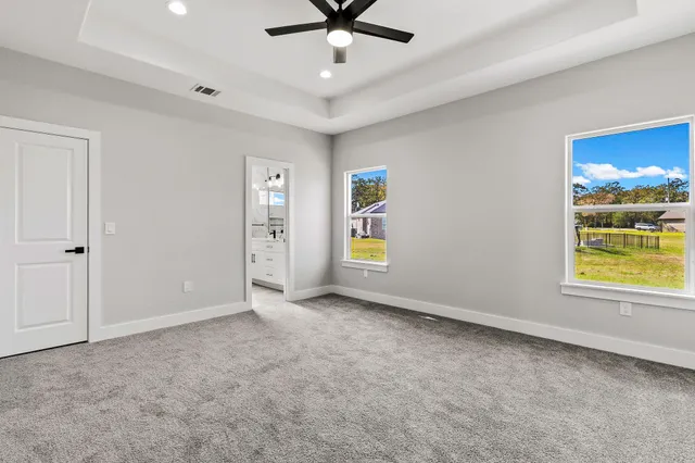 a bathroom with a double vanity sink a large mirror and shower