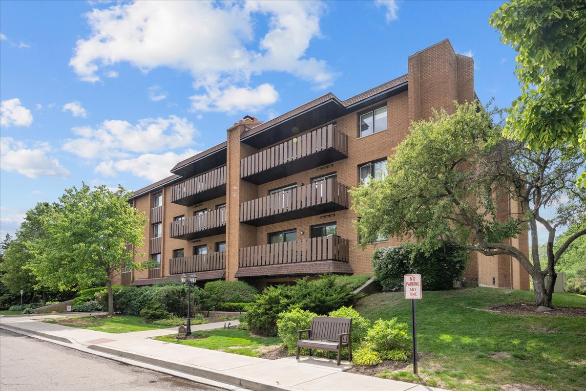 1795 Lake Cook Road, Unit 107 Highland Park, IL 60035 - Photo 2 of 26 a view of a building next to a yard