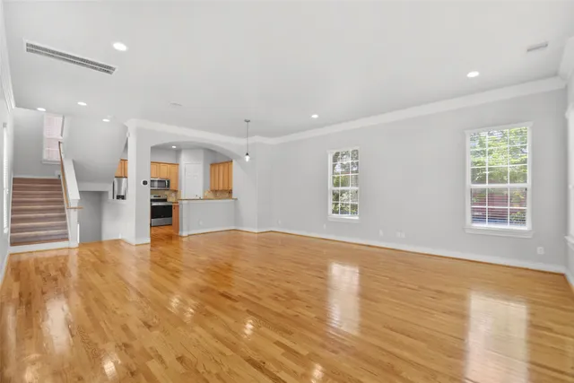 a view of kitchen with refrigerator and window
