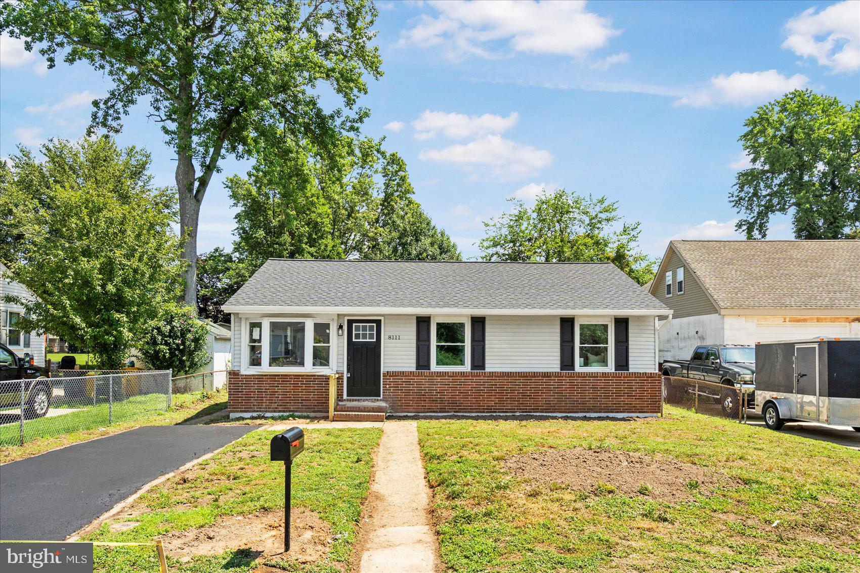 8111 Holly Road Curtis Bay, MD 21226 - Photo 2 of 46 front view of a house with a patio