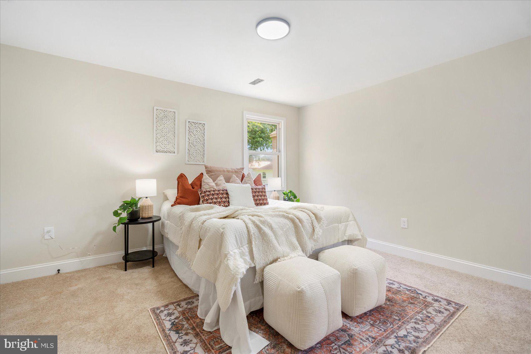 8111 Holly Road Curtis Bay, MD 21226 - Photo 23 of 46 a bed room with bed and a window