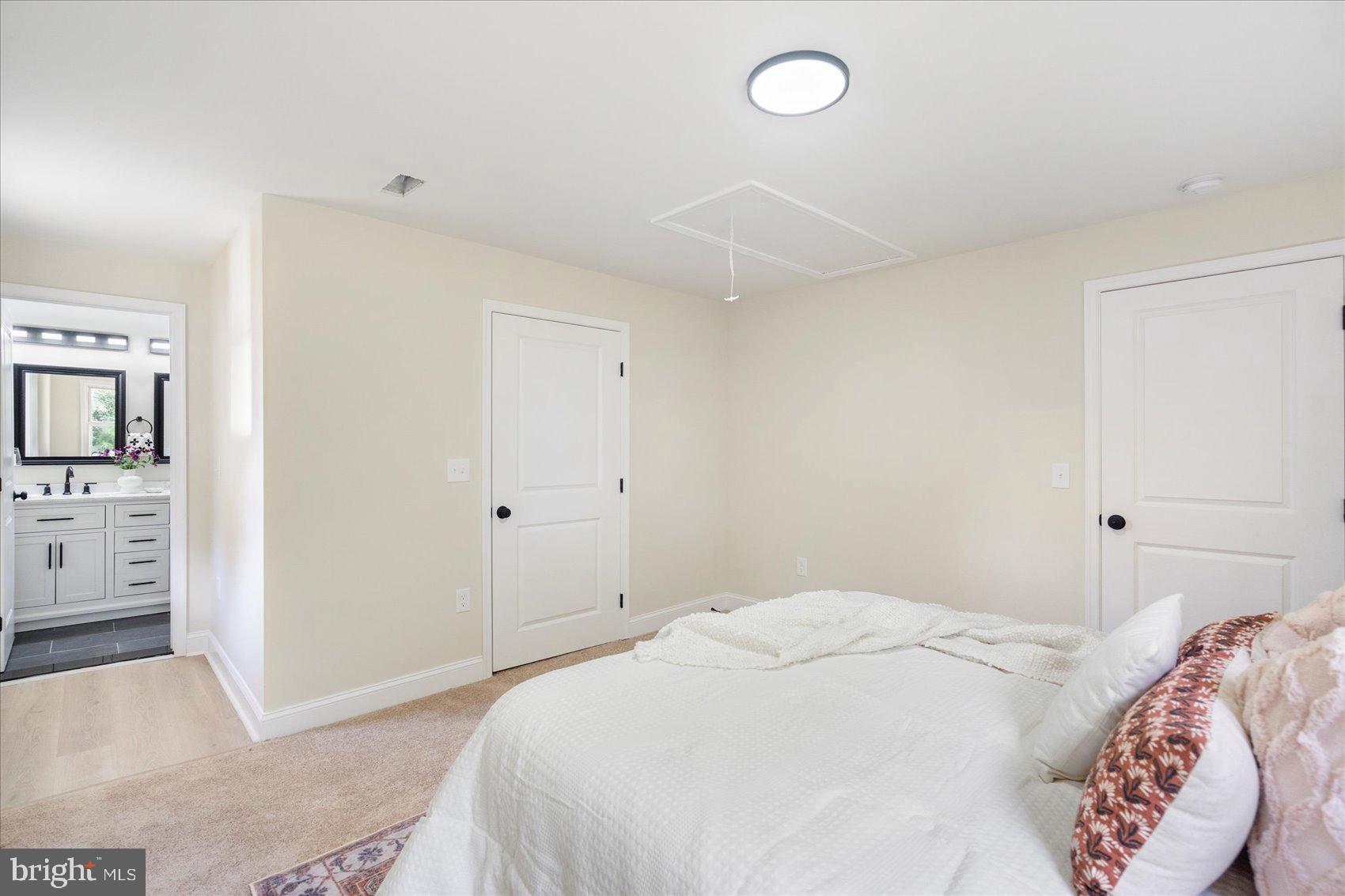 8111 Holly Road Curtis Bay, MD 21226 - Photo 26 of 46 a bedroom with a bed and a television