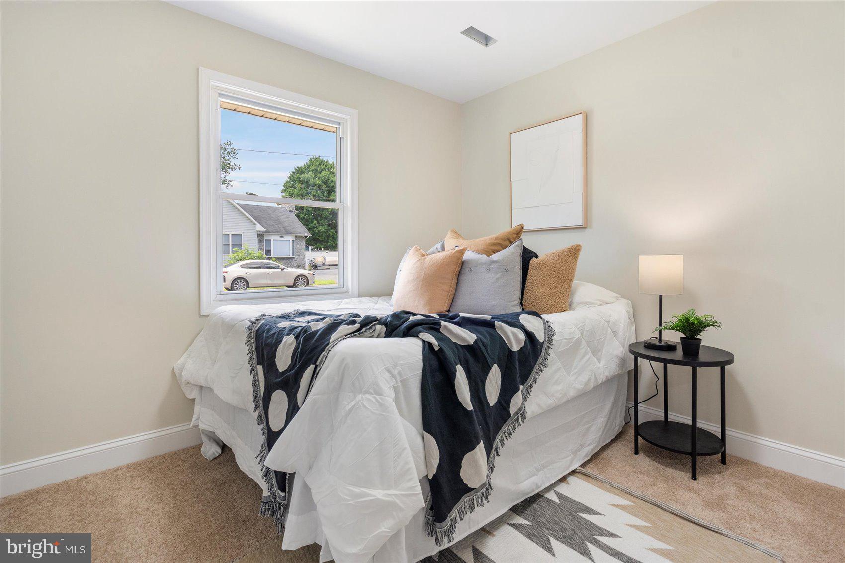 8111 Holly Road Curtis Bay, MD 21226 - Photo 30 of 46 a bedroom with a bed and window