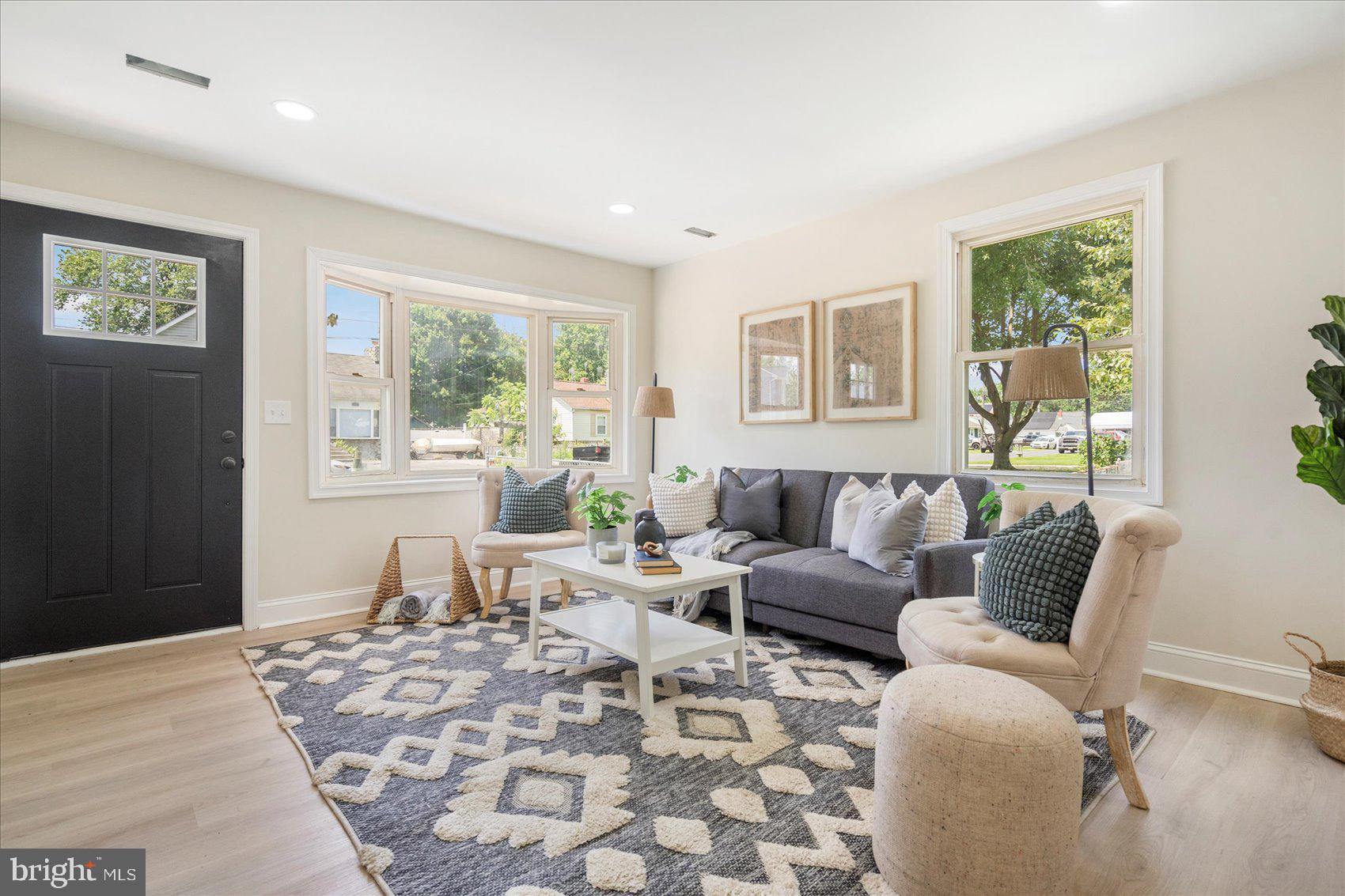 8111 Holly Road Curtis Bay, MD 21226 - Photo 3 of 46 a living room with furniture and large window