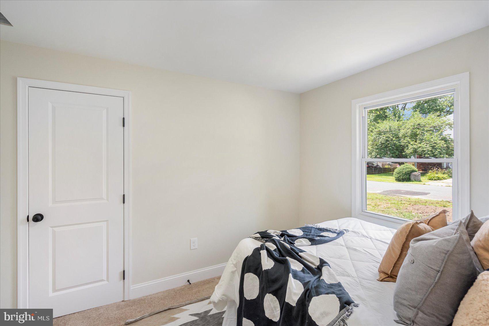 8111 Holly Road Curtis Bay, MD 21226 - Photo 32 of 46 a bedroom with a bed and a window