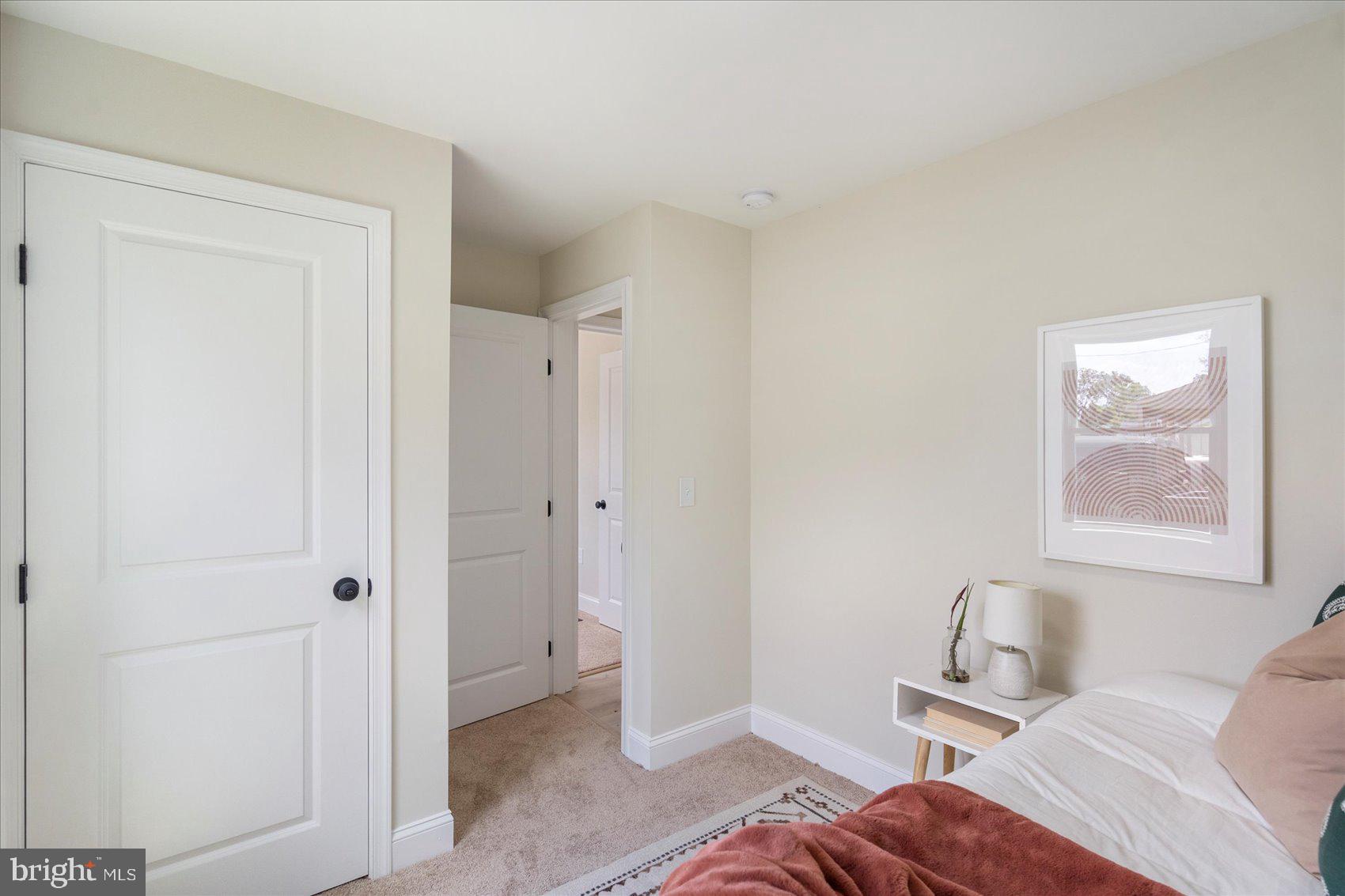 8111 Holly Road Curtis Bay, MD 21226 - Photo 37 of 46 a bedroom with a bed and a window