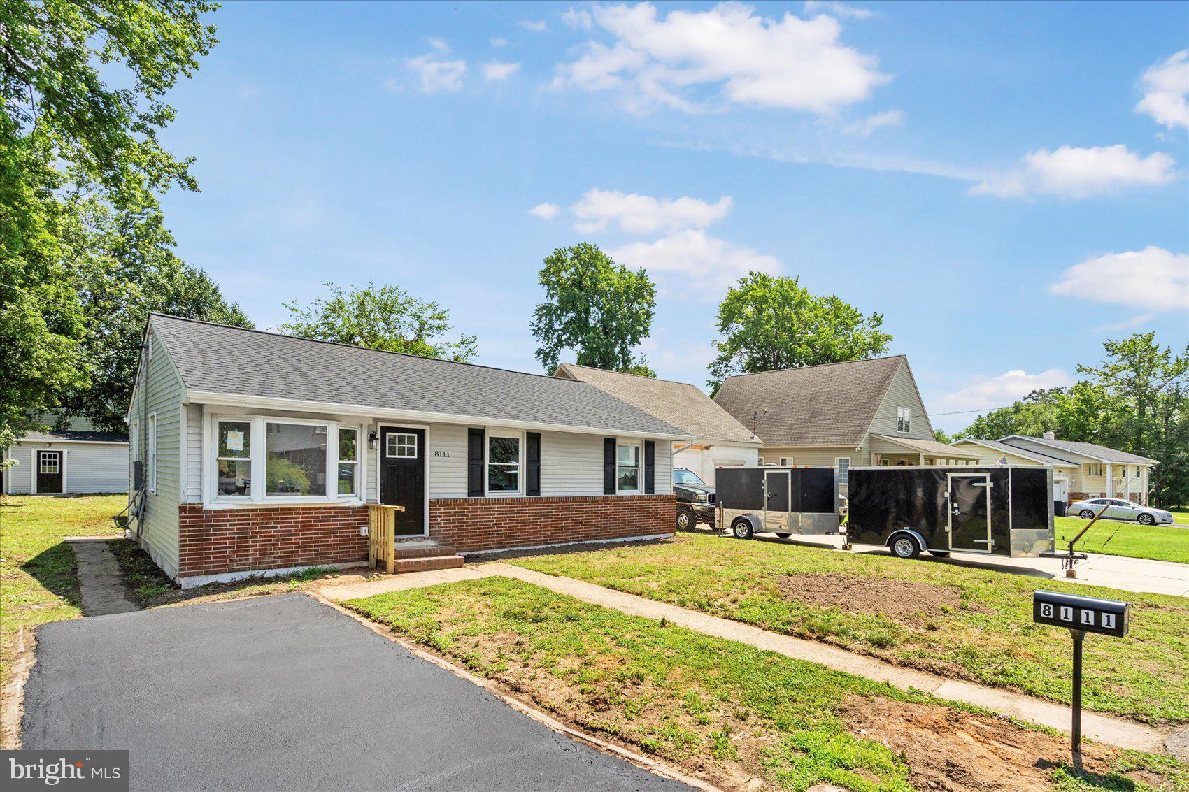 8111 Holly Road Curtis Bay, MD 21226 - Photo 41 of 46 a front view of a house with a yard