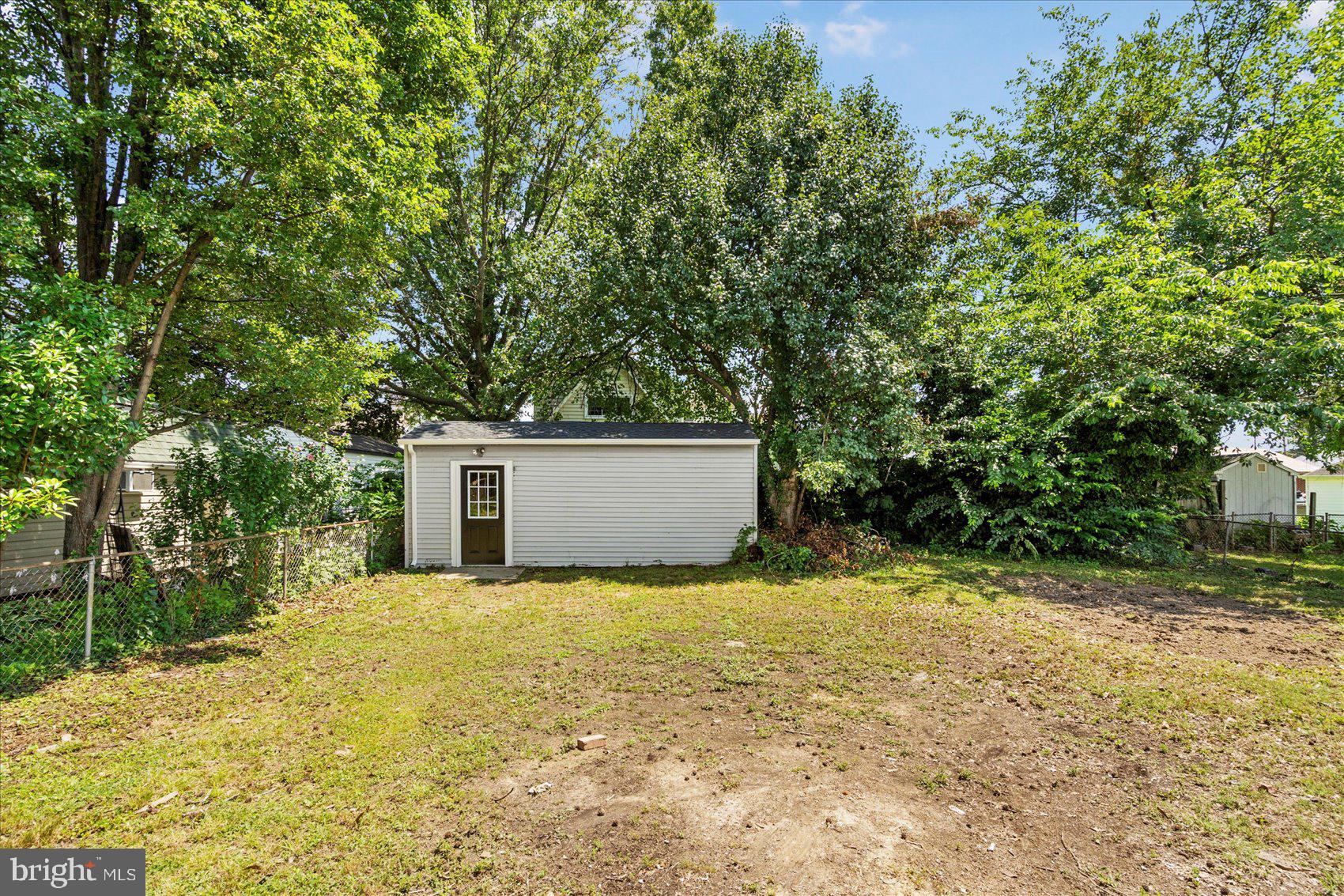 8111 Holly Road Curtis Bay, MD 21226 - Photo 45 of 46 a view of a house with a yard