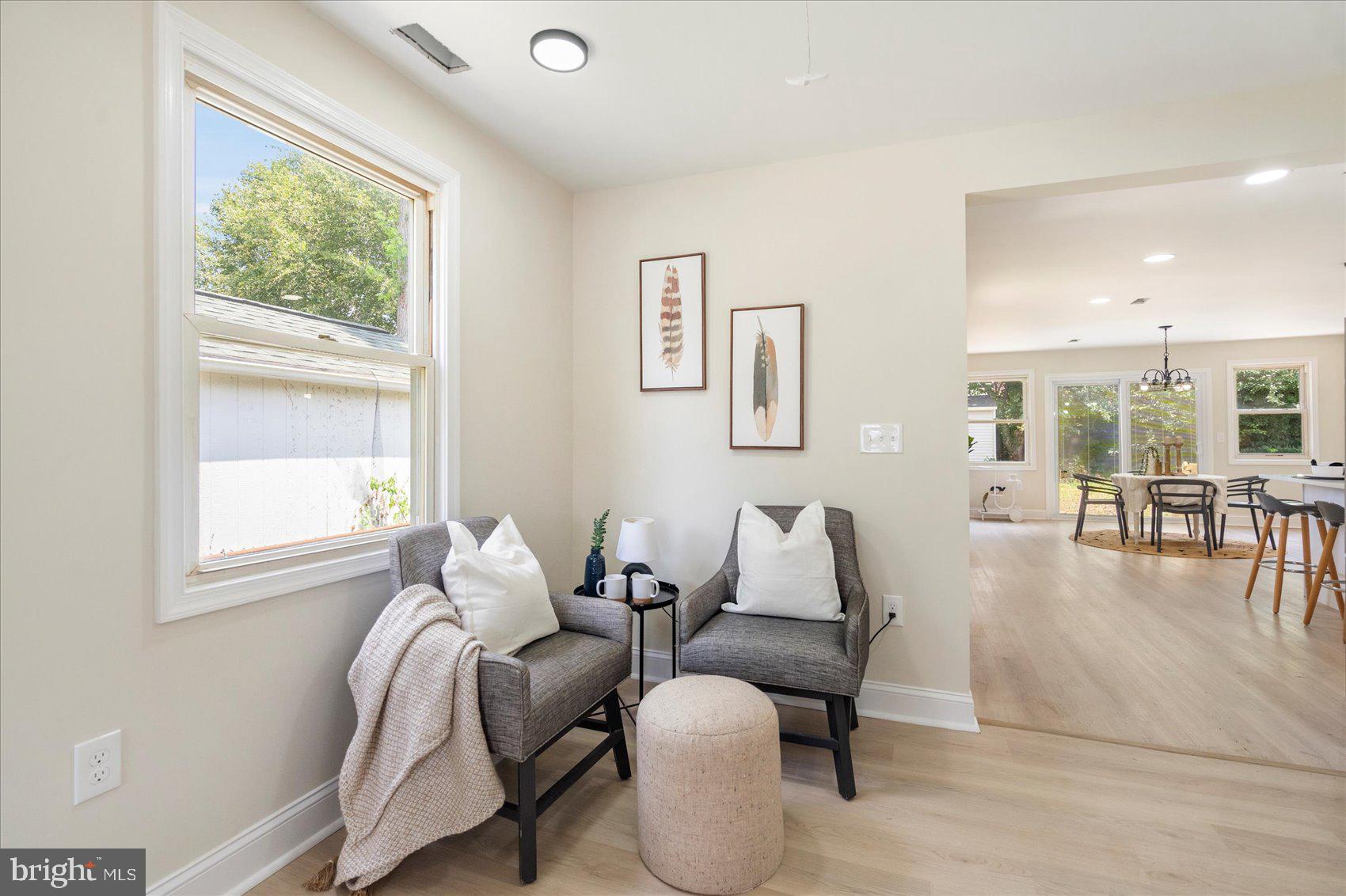 8111 Holly Road Curtis Bay, MD 21226 - Photo 5 of 46 a living room with furniture and floor to ceiling windows