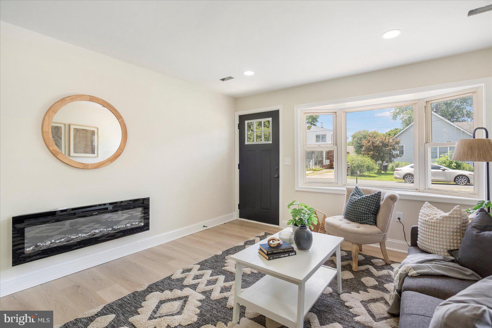 8111 Holly Road Curtis Bay, MD 21226 - Photo 7 of 46 a living room with furniture and a floor to ceiling window