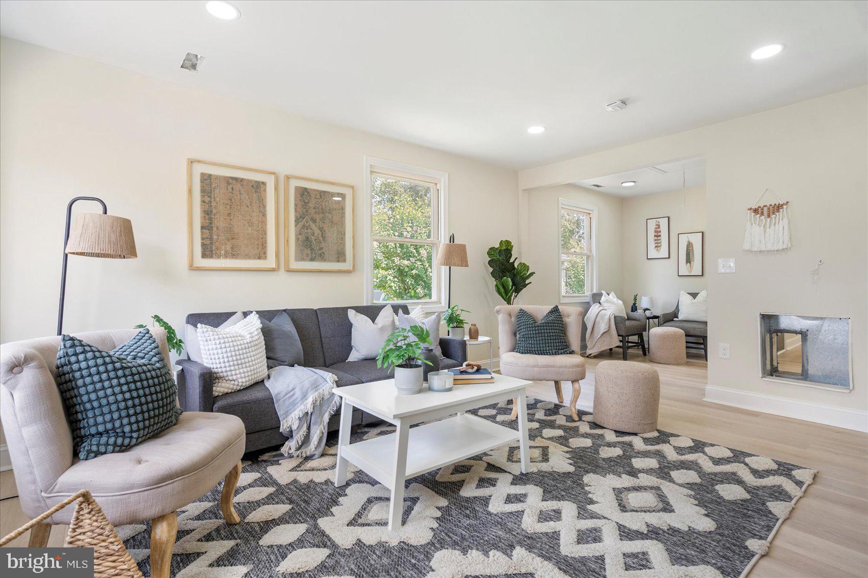 8111 Holly Road Curtis Bay, MD 21226 - Photo 8 of 46 a living room with furniture and wooden floor