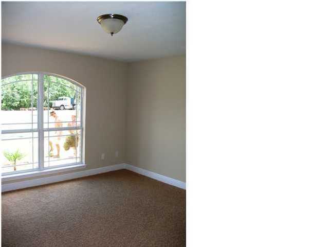 9984 Nichols Lake Road Milton, FL 32583 - Photo 4 of 21 a view of a room that has a window in it