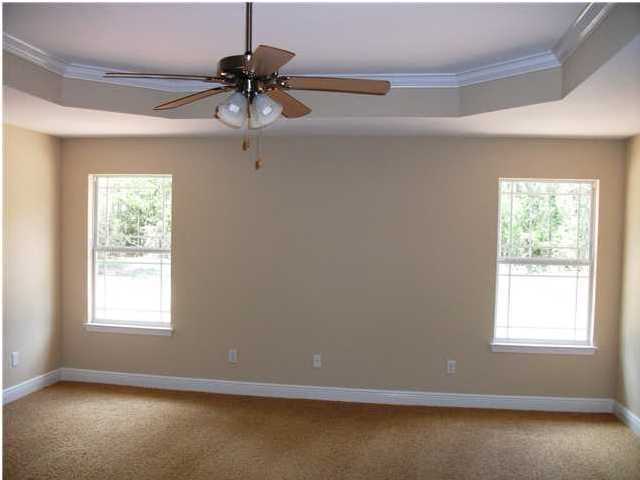 9984 Nichols Lake Road Milton, FL 32583 - Photo 6 of 21 a view of room with window and ceiling fan