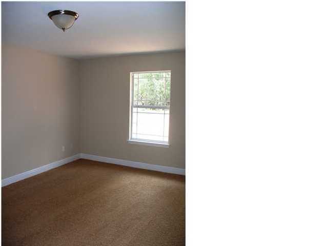 9984 Nichols Lake Road Milton, FL 32583 - Photo 7 of 21 a view of an empty room with a window