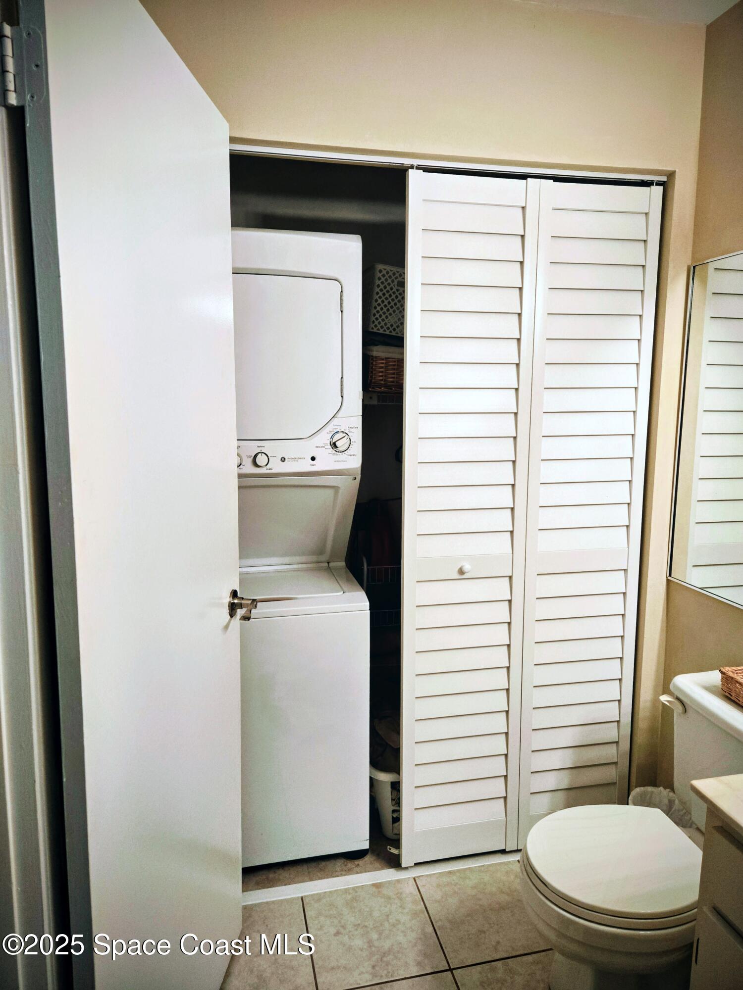 1123 Breezy Way, Unit 8C Sebastian, FL 32958 - Photo 14 of 26 a bathroom with a toilet and a shower