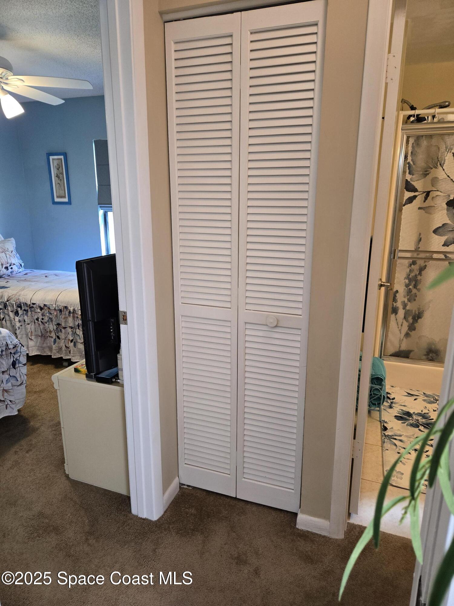 1123 Breezy Way, Unit 8C Sebastian, FL 32958 - Photo 17 of 26 a view of a bedroom with furniture and a window