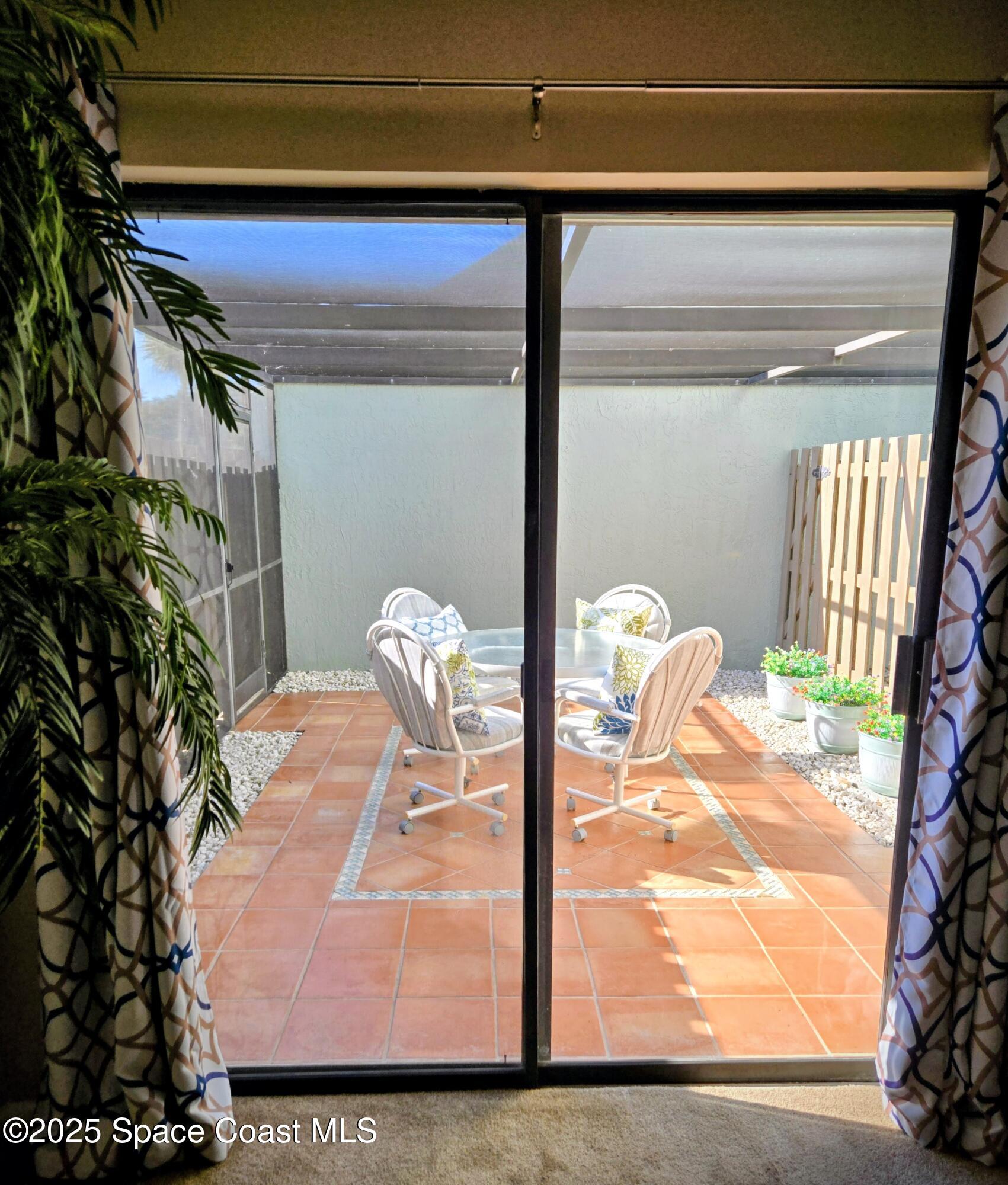 1123 Breezy Way, Unit 8C Sebastian, FL 32958 - Photo 18 of 26 a bedroom with a bed and a potted plant