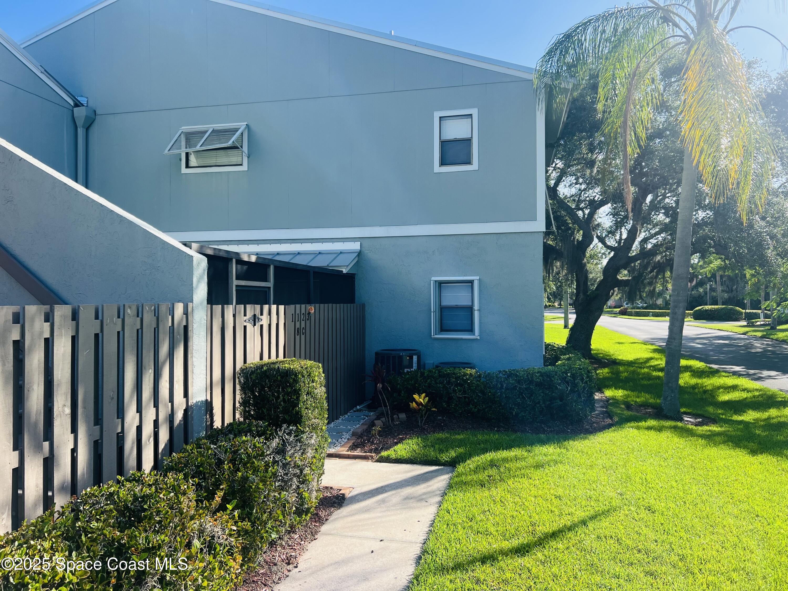 1123 Breezy Way, Unit 8C Sebastian, FL 32958 - Photo 2 of 26 a view of swimming pool with a backyard