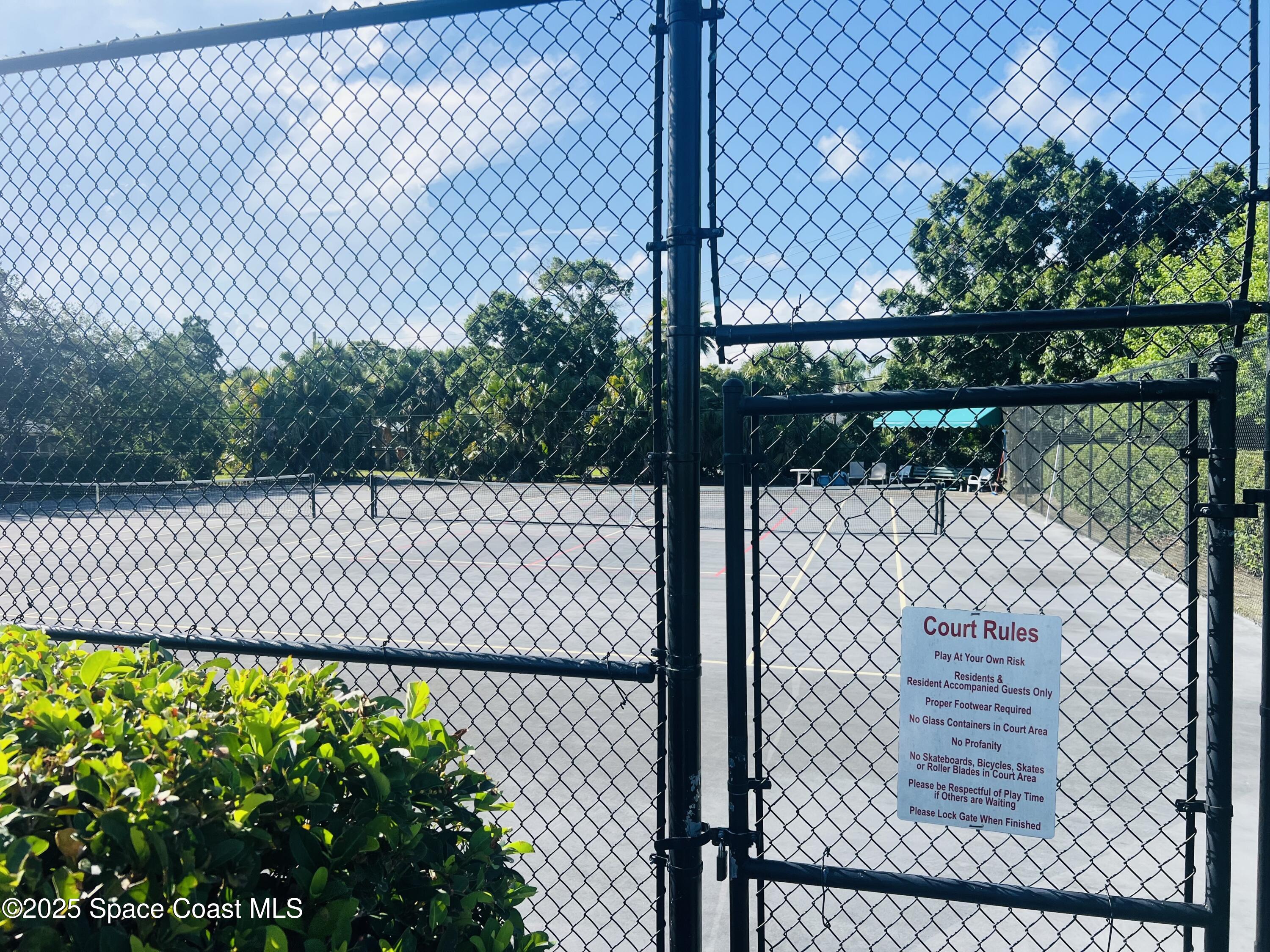 1123 Breezy Way, Unit 8C Sebastian, FL 32958 - Photo 21 of 26 a view of a fence