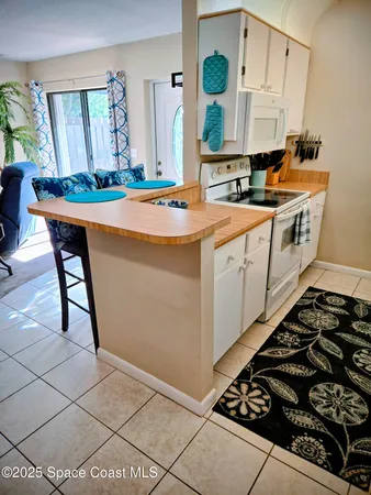 a kitchen with a sink and a stove top oven