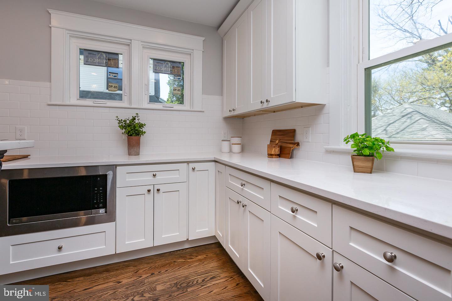 324 Strathmore Road Havertown, PA 19083 - Photo 17 of 53 a kitchen with stainless steel appliances white cabinets and a potted plant