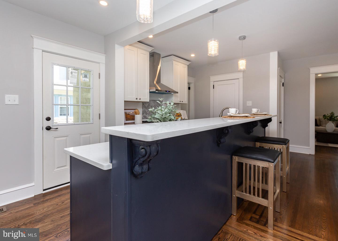 324 Strathmore Road Havertown, PA 19083 - Photo 18 of 53 a kitchen with kitchen island a sink appliances and cabinets