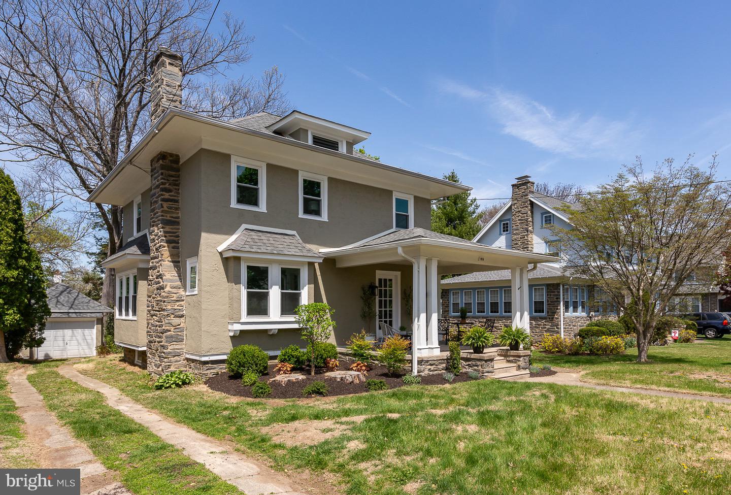324 Strathmore Road Havertown, PA 19083 - Photo 2 of 53 a front view of a house with swimming pool and garden