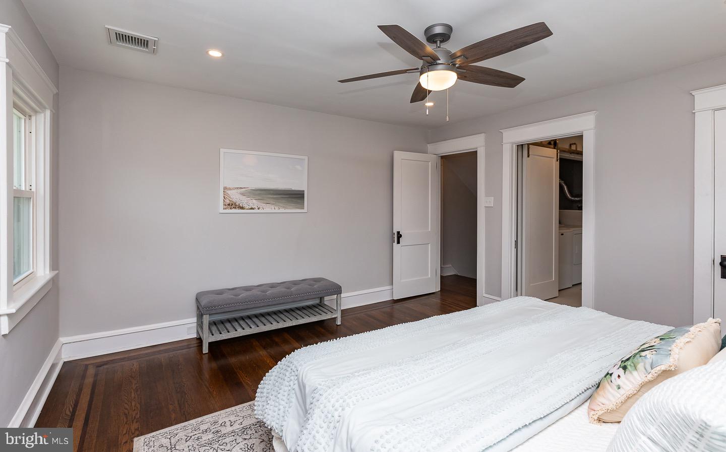 324 Strathmore Road Havertown, PA 19083 - Photo 24 of 53 a bedroom with a bed and a chandelier