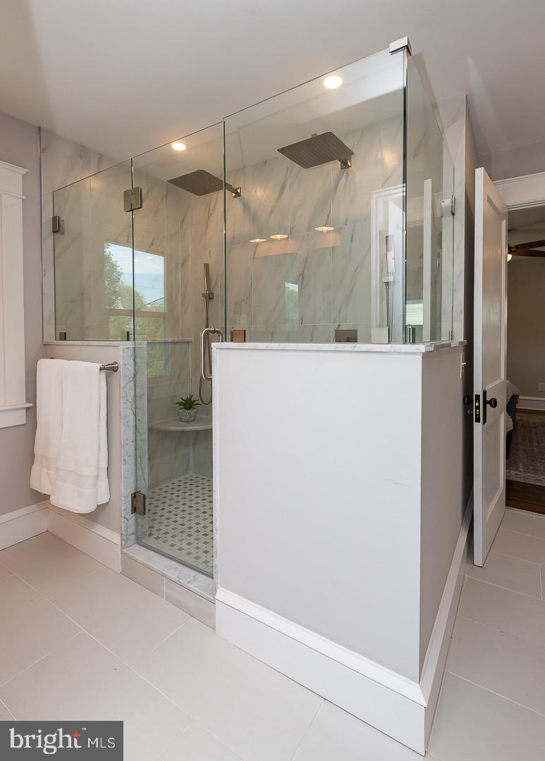 324 Strathmore Road Havertown, PA 19083 - Photo 27 of 53 a bathroom with a shower and a tub