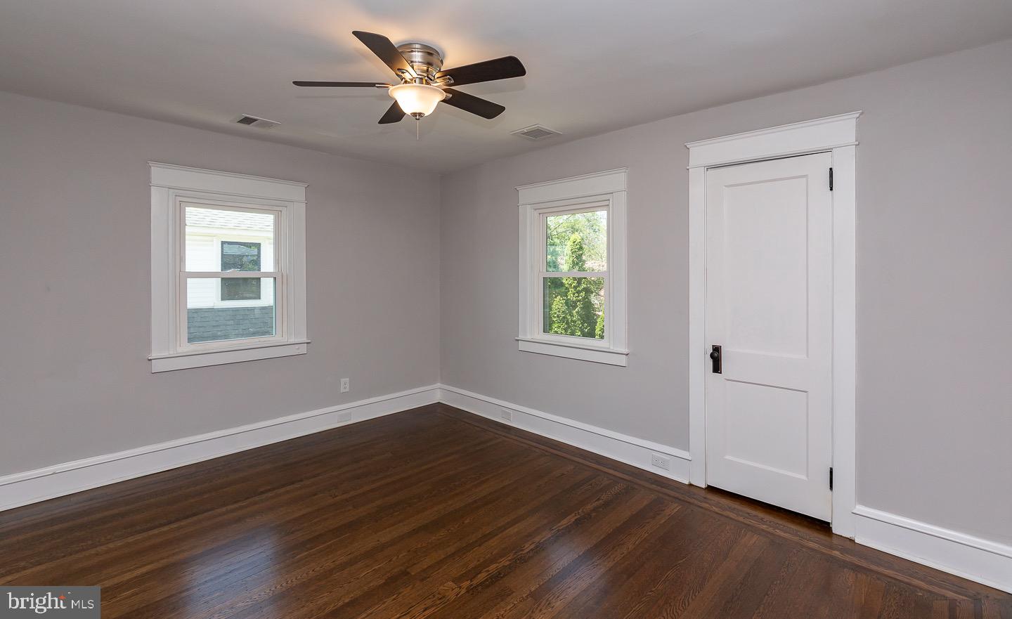 324 Strathmore Road Havertown, PA 19083 - Photo 33 of 53 a view of an empty room with a window and wooden floor