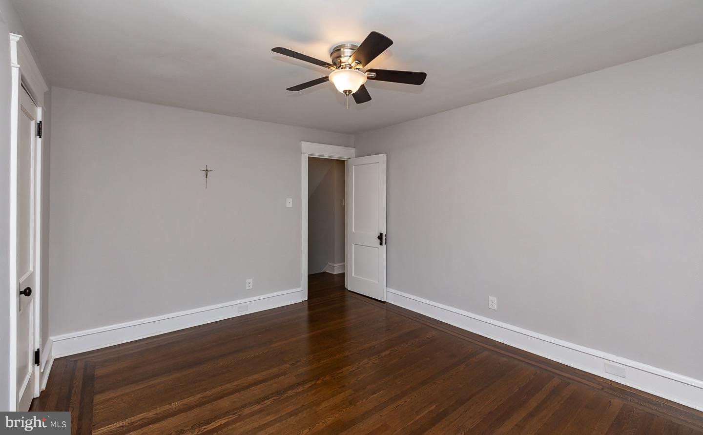 324 Strathmore Road Havertown, PA 19083 - Photo 34 of 53 an empty room with wooden floor and ceiling fan