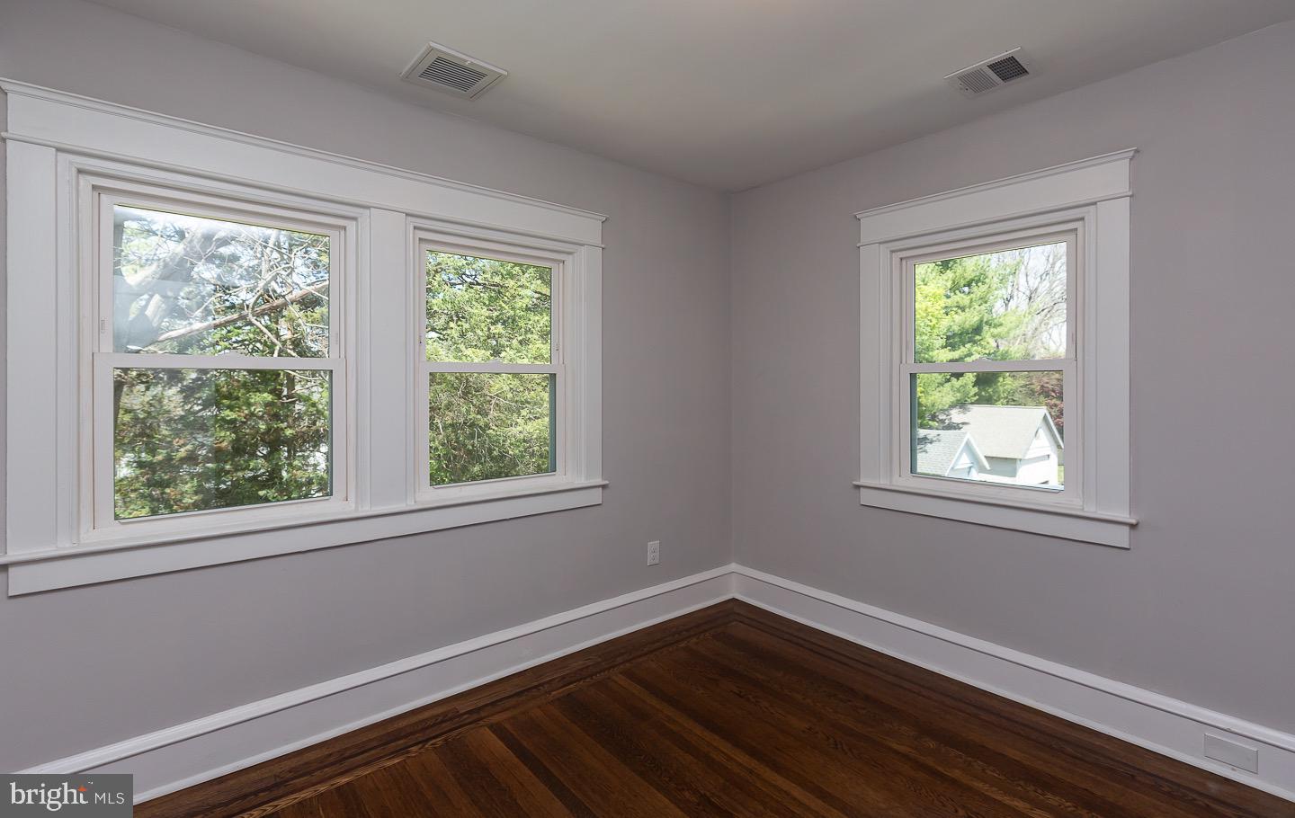 324 Strathmore Road Havertown, PA 19083 - Photo 38 of 53 a view of an empty room with wooden floor and a window