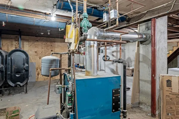 a utility room with multiple dryer and washer