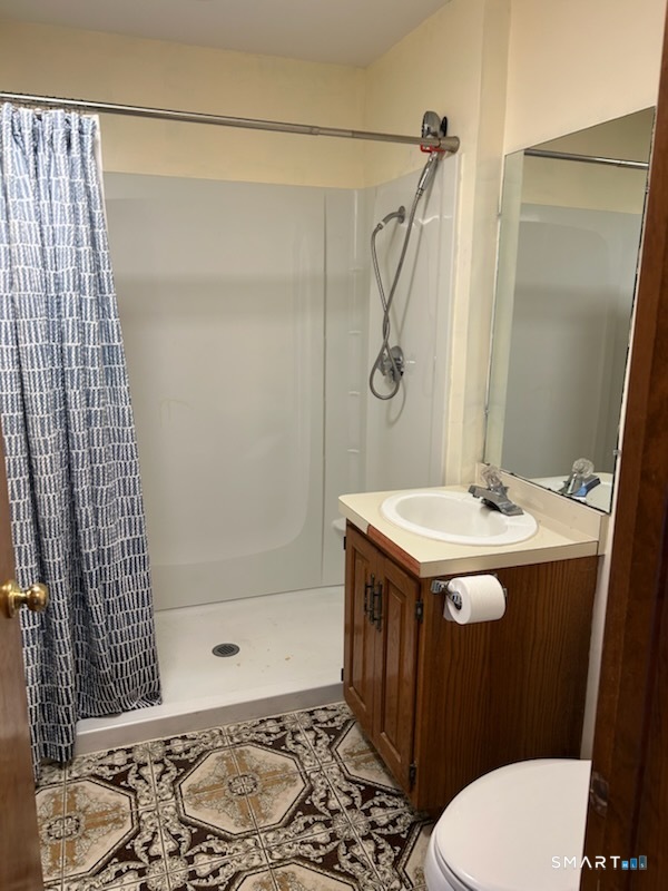 122 Cornfield Road Milford, CT 06461 - Photo 14 of 14 a bathroom with a sink toilet and shower