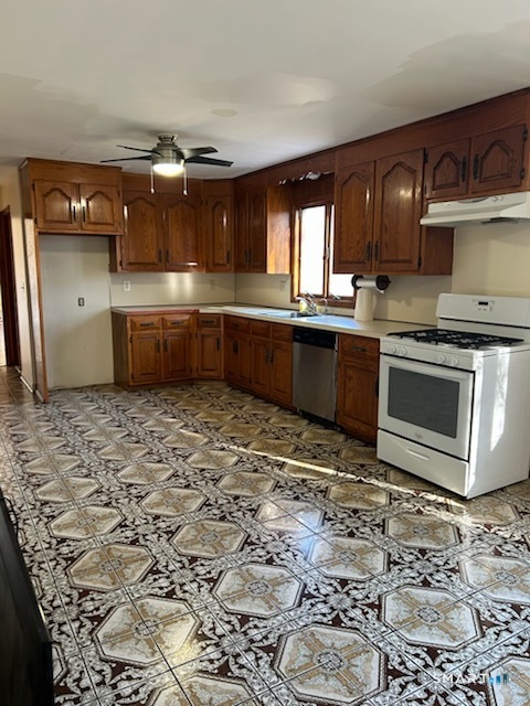 122 Cornfield Road Milford, CT 06461 - Photo 3 of 14 a kitchen with stainless steel appliances granite countertop a stove a sink and a microwave