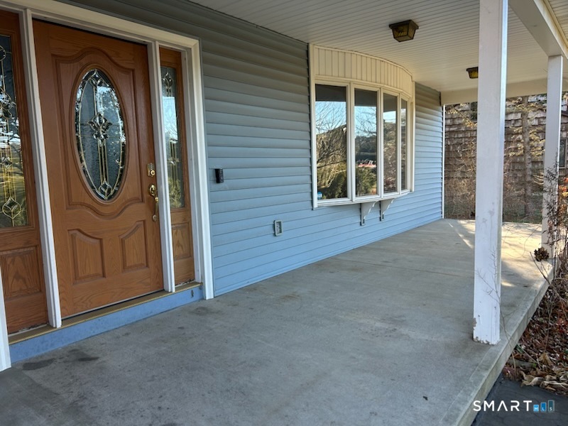 122 Cornfield Road Milford, CT 06461 - Photo 7 of 14 a view of an entryway with a house