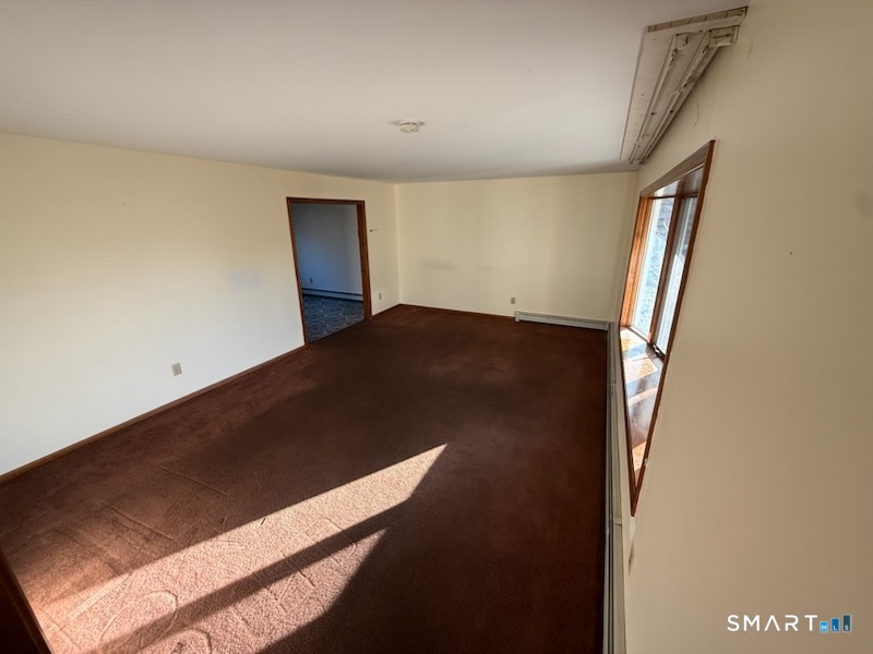 122 Cornfield Road Milford, CT 06461 - Photo 9 of 14 wooden floor in an empty room
