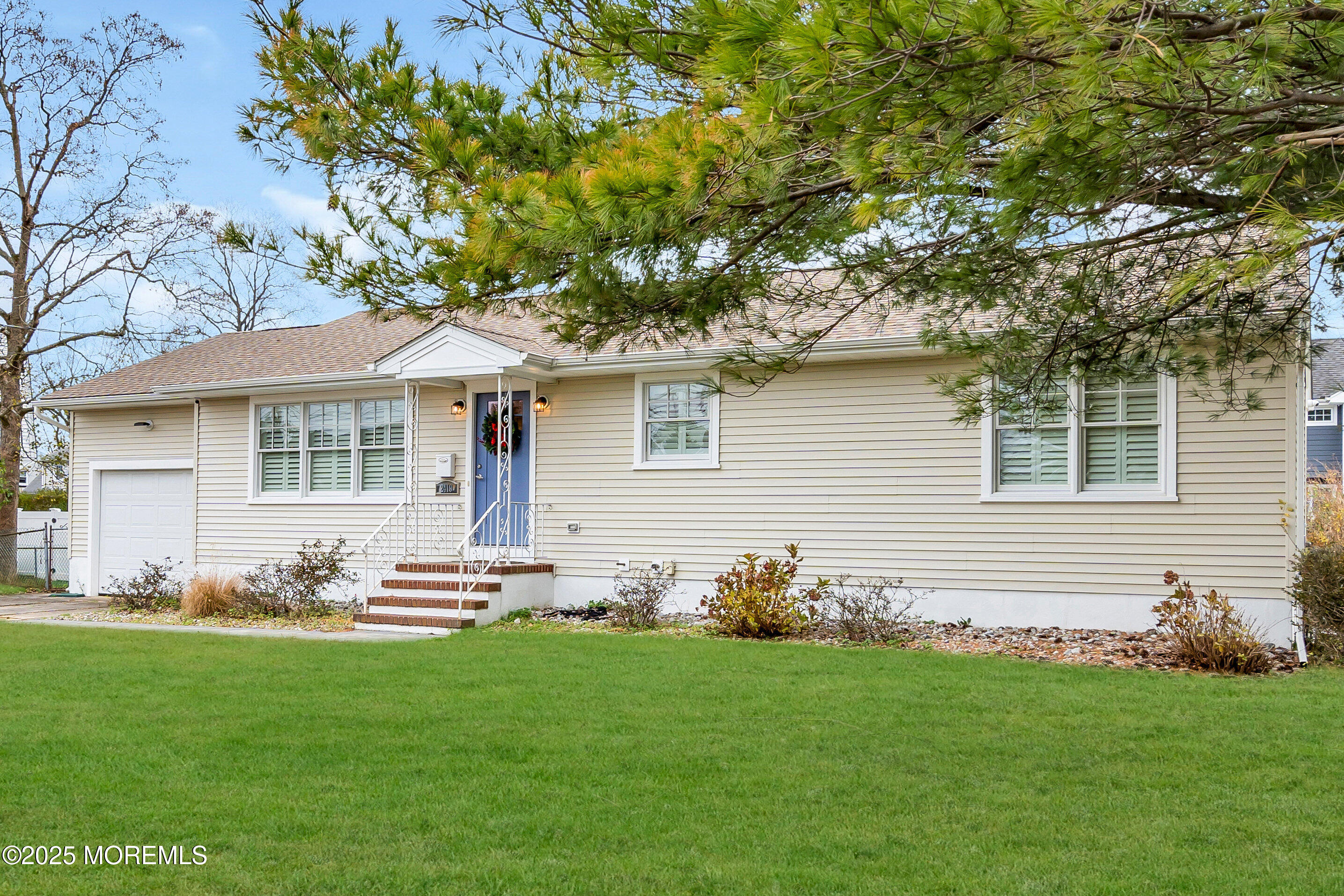 2419 Kipling Avenue Spring Lake Heights, NJ 07762 - Photo 1 of 37 a front view of a house with a garden