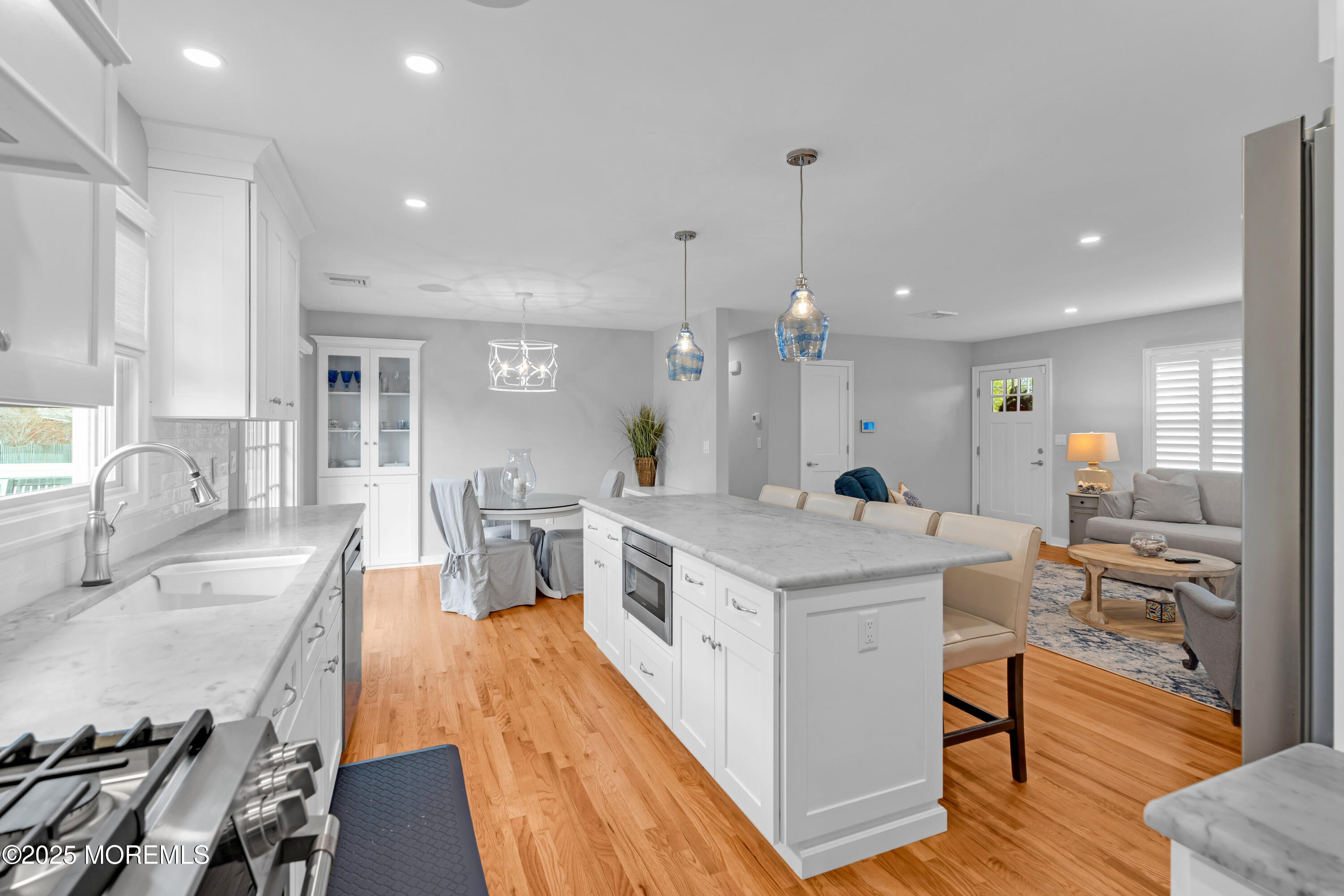 2419 Kipling Avenue Spring Lake Heights, NJ 07762 - Photo 13 of 37 a large kitchen with stainless steel appliances a stove center island a large window and chairs