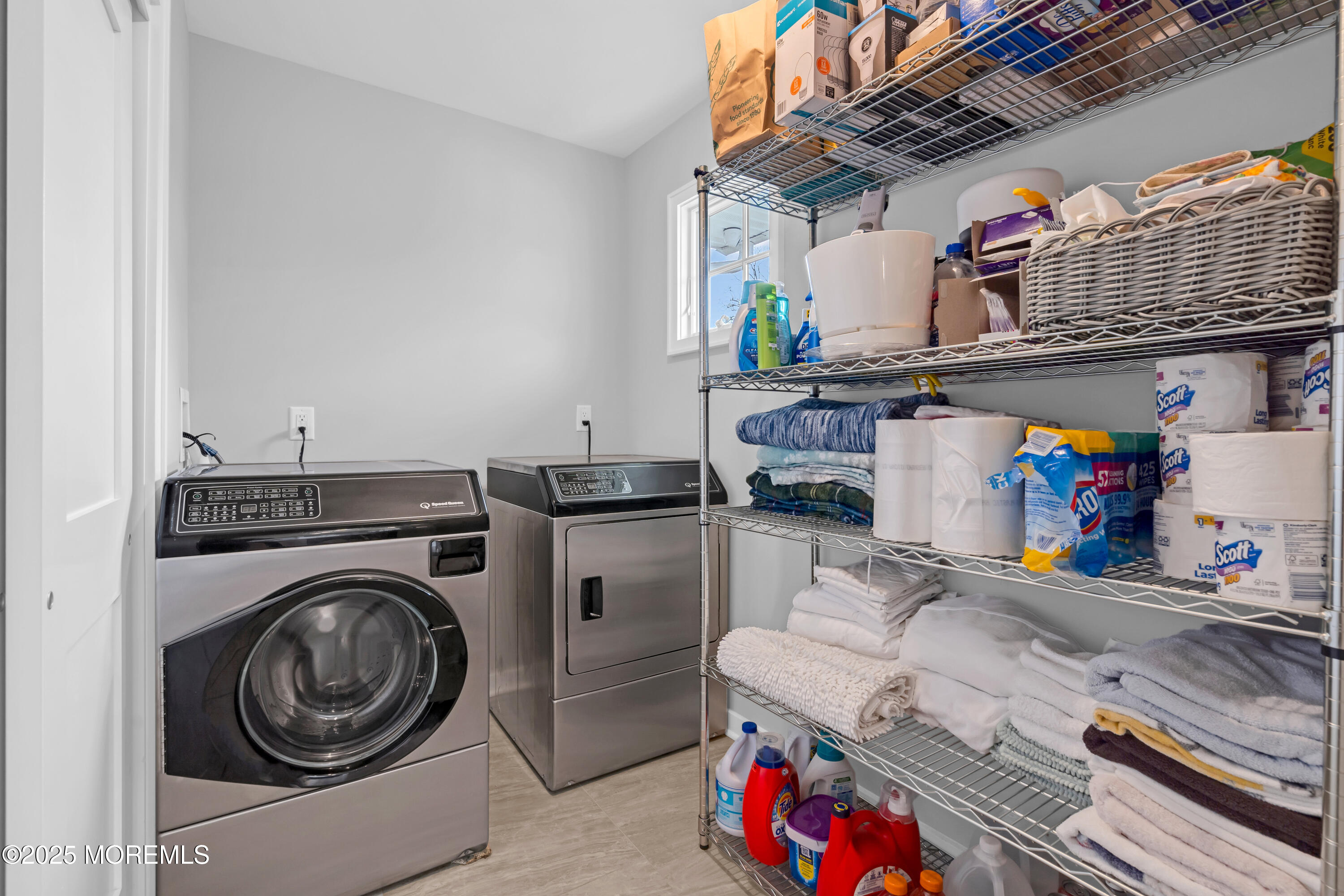 2419 Kipling Avenue Spring Lake Heights, NJ 07762 - Photo 20 of 37 a utility room with dryer washer and a view of living room