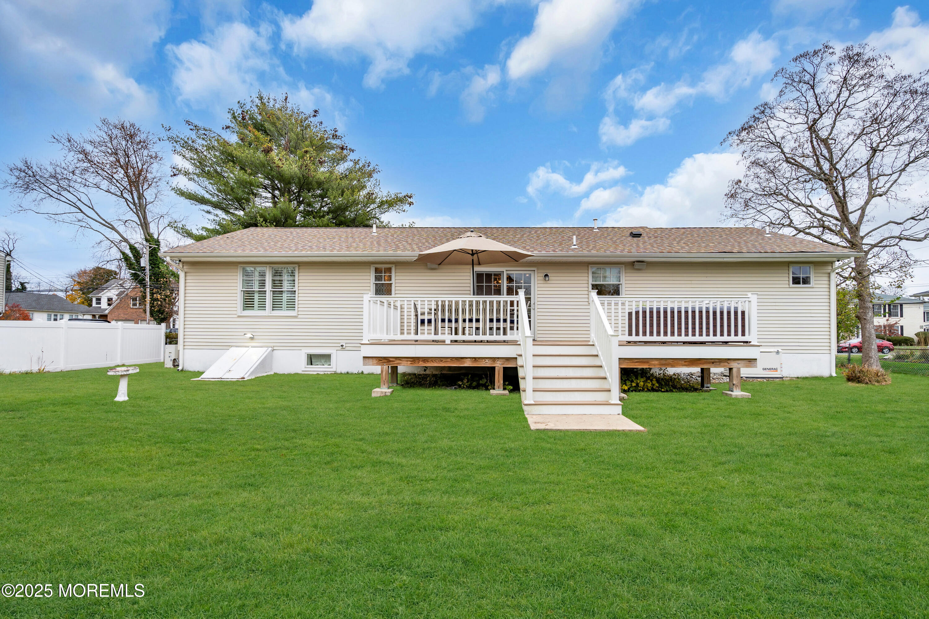2419 Kipling Avenue Spring Lake Heights, NJ 07762 - Photo 33 of 37 a front view of a house with a garden