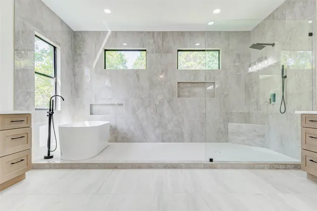 a view of a hallway with wooden floor and entryway