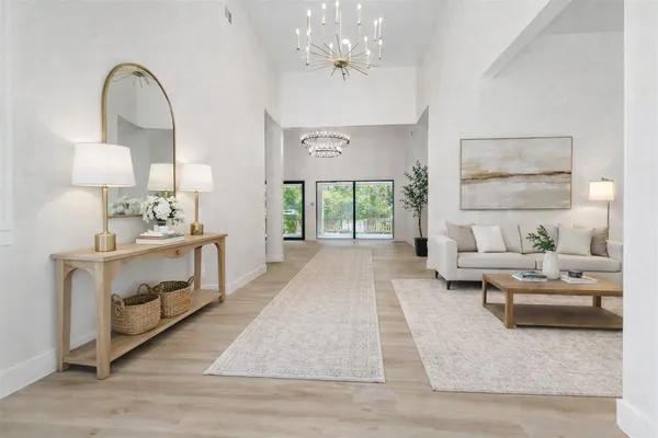 a lobby with furniture and potted plant