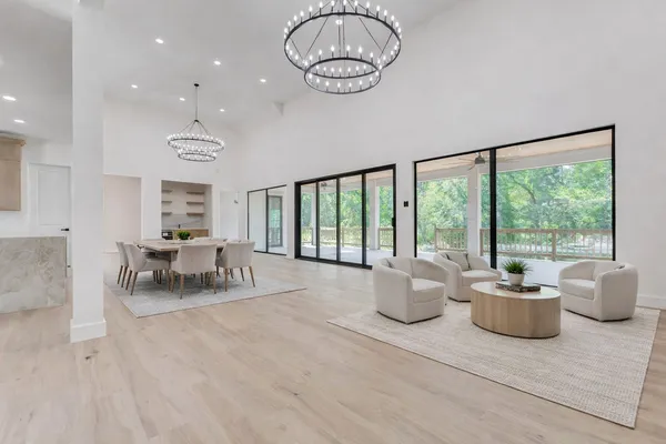 a kitchen with kitchen island granite countertop a table and chairs in it