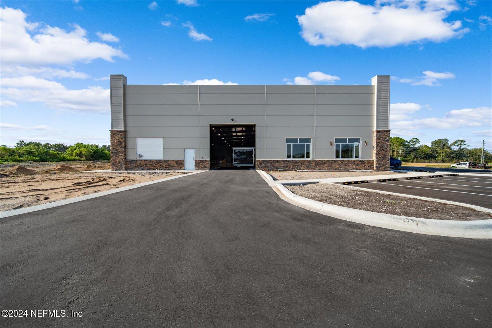6255 Colbert Lane Flagler Beach, FL 32136 - Photo 3 of 16 a view of a building with a road