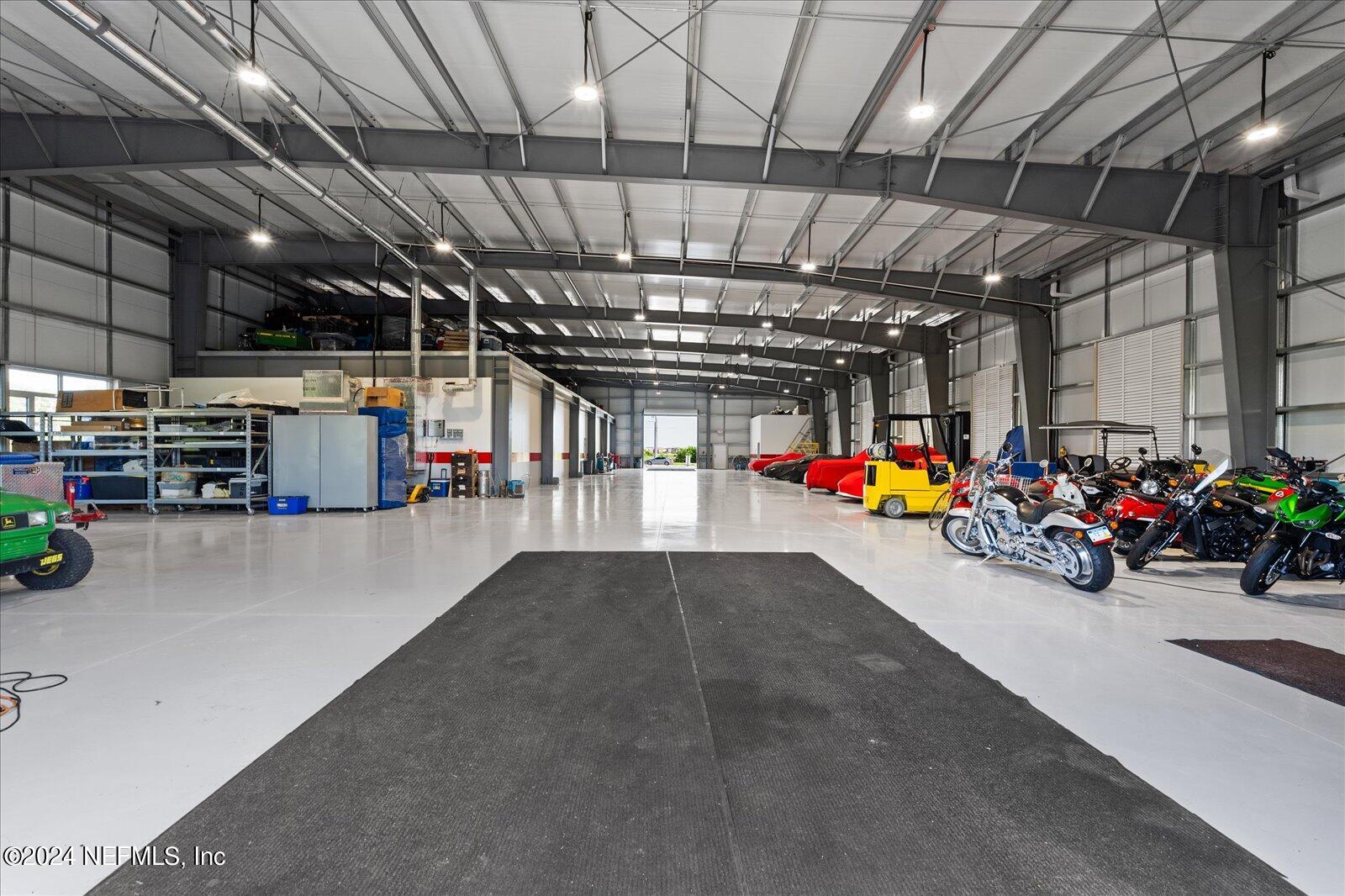 6255 Colbert Lane Flagler Beach, FL 32136 - Photo 6 of 16 a view of parking garage with cars