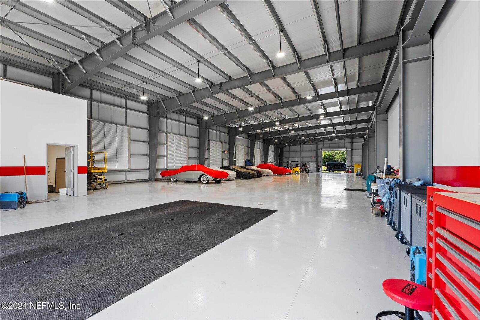 6255 Colbert Lane Flagler Beach, FL 32136 - Photo 7 of 16 a view of parking garage with cars