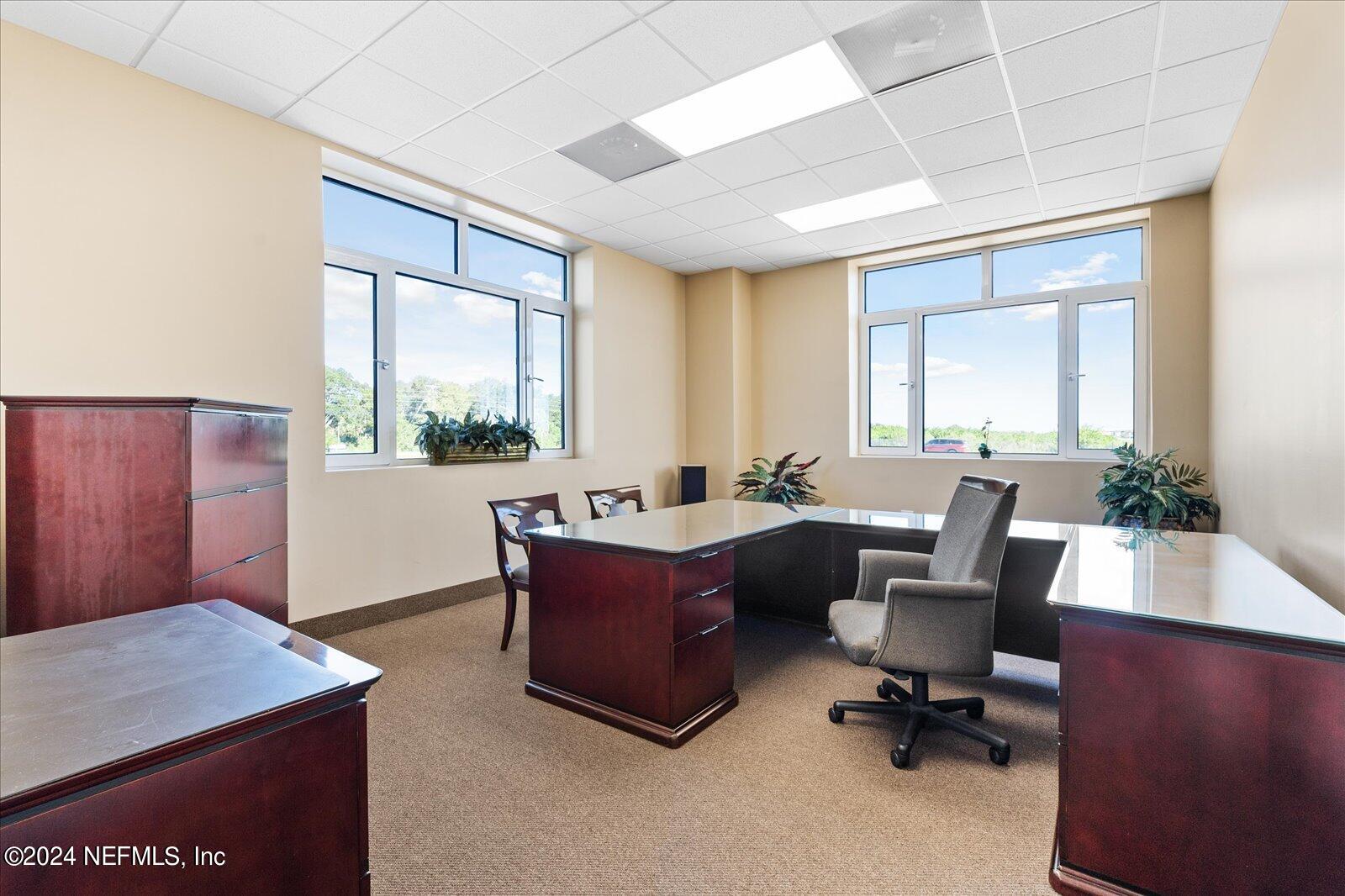 6255 Colbert Lane Flagler Beach, FL 32136 - Photo 9 of 16 a view of a workspace with furniture and a window