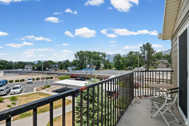 8248 South Resaca Drive, Unit J10 Sandy, UT 84070 - Photo 23 of 40 Private balcony featuring a concrete floor and black metal railings